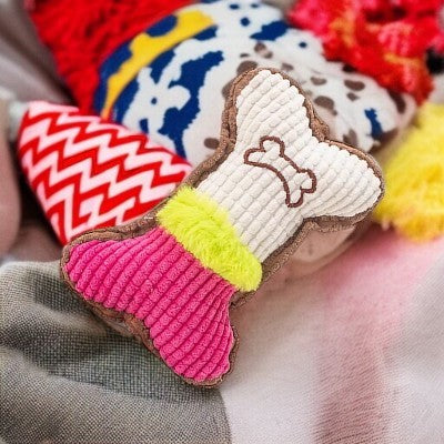 Jouet-pour-chien-os-couineur-rose-blanc